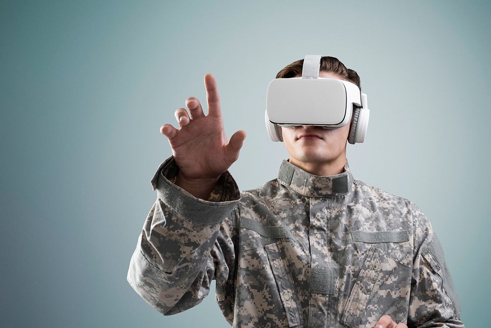 Soldier in VR headset touching virtual screen military technology
