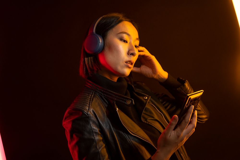 Woman listening music on smartphone
