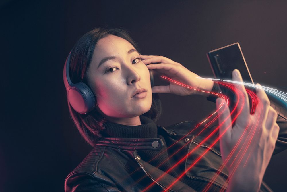 Woman listening music on her smartphone
