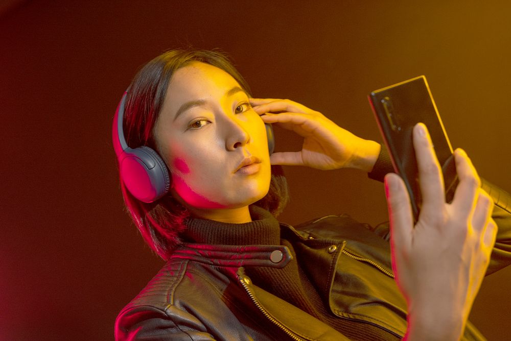 Woman wearing black wireless headphones 