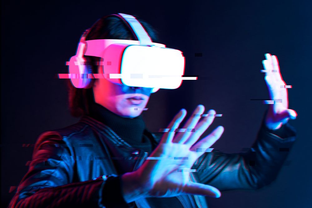 Woman using virtual reality gadget for entertainment