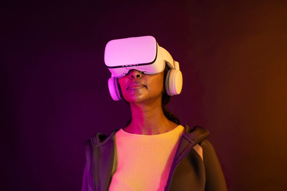 African American woman in virtual reality glasses smart technology