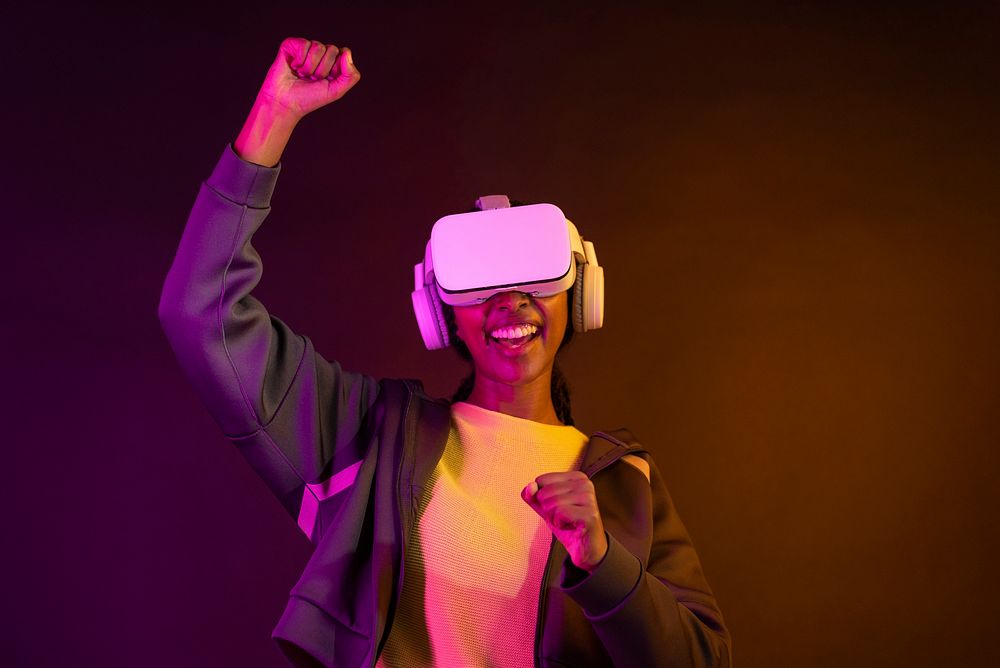 African American woman using virtual reality gadget for entertainment