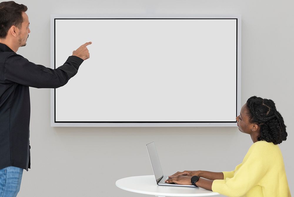 Blank projecting screen with colleagues in a meeting smart technology