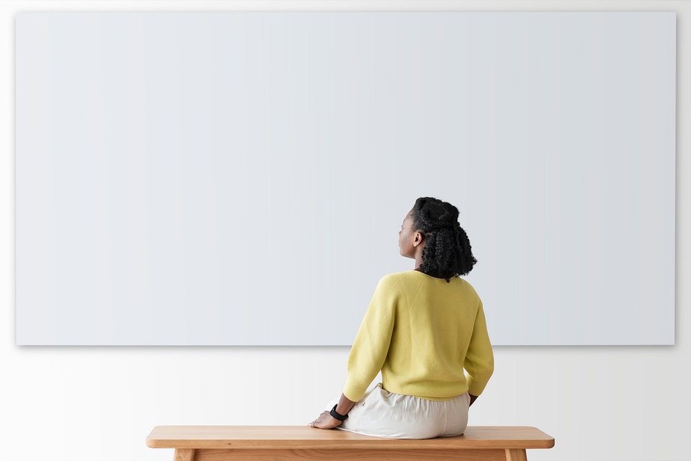 Woman with projector wall mockup psd rear view