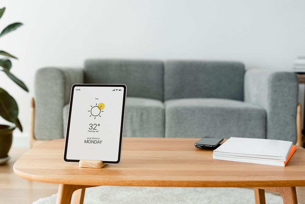 Digital tablet screen mockup psd on a wooden table