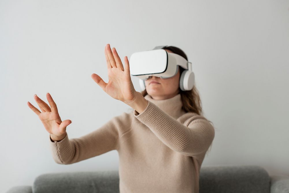 Woman experiencing VR simulation entertainment technology