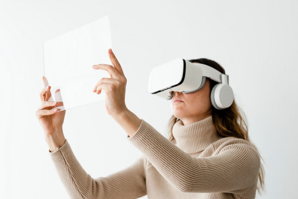 Woman with transparent tablet mockup psd and VR headset psd entertainment technology
