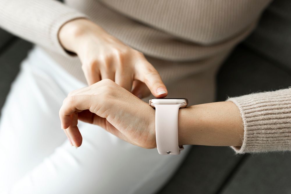 Woman looking at smartwatch wearable technology