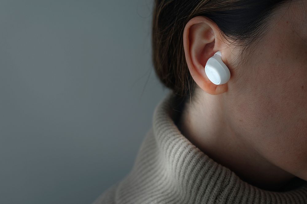 Woman wearing wireless earbuds mockup psd