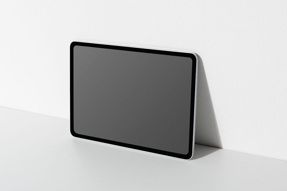 Digital tablet screen mockup psd lean on the wall