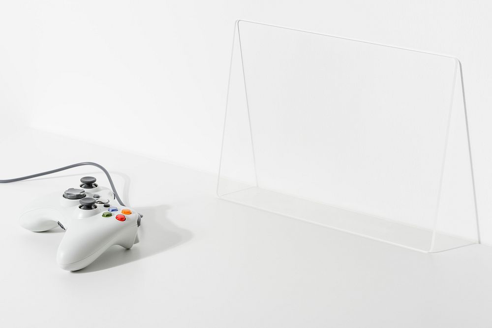 White gaming controller psd on white floor