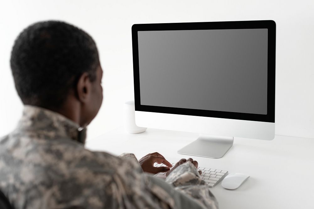 Military officer using computer desktop