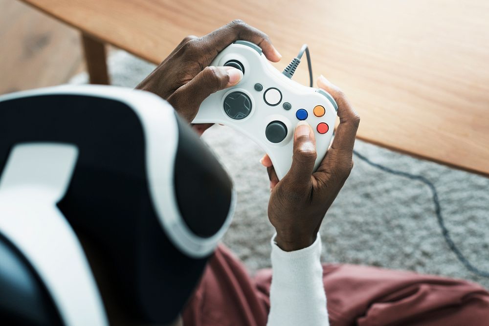 African man playing a game with gaming controller
