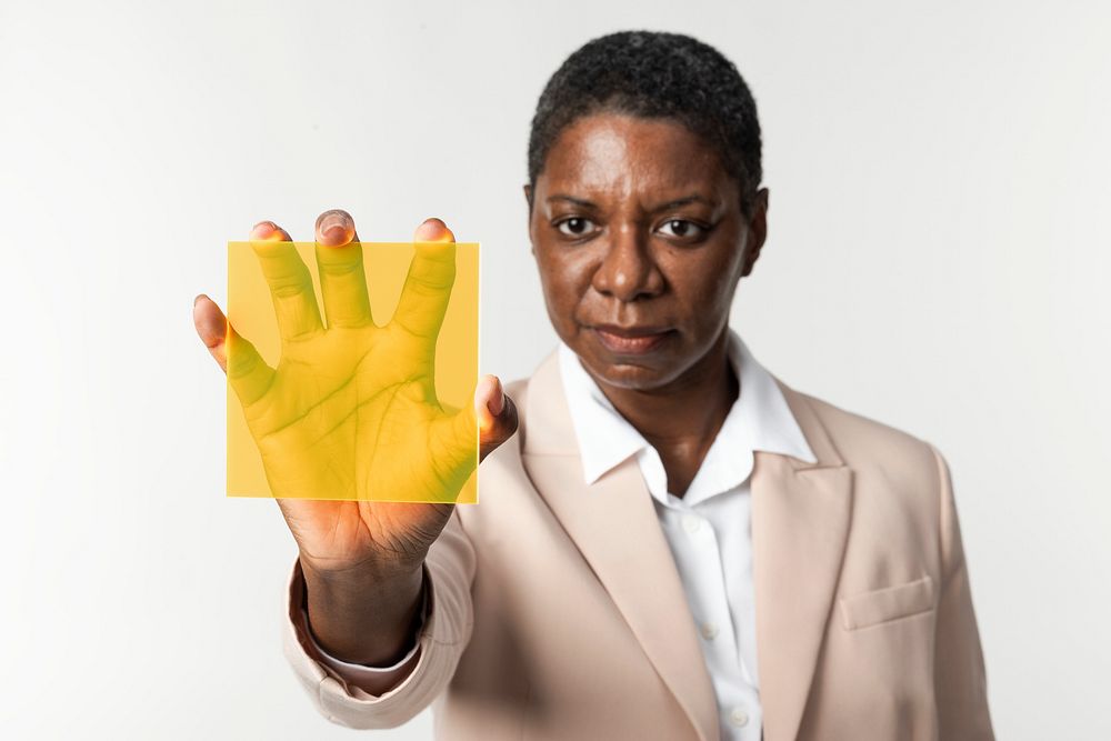 Woman presenting yellow transparent plate smart technology