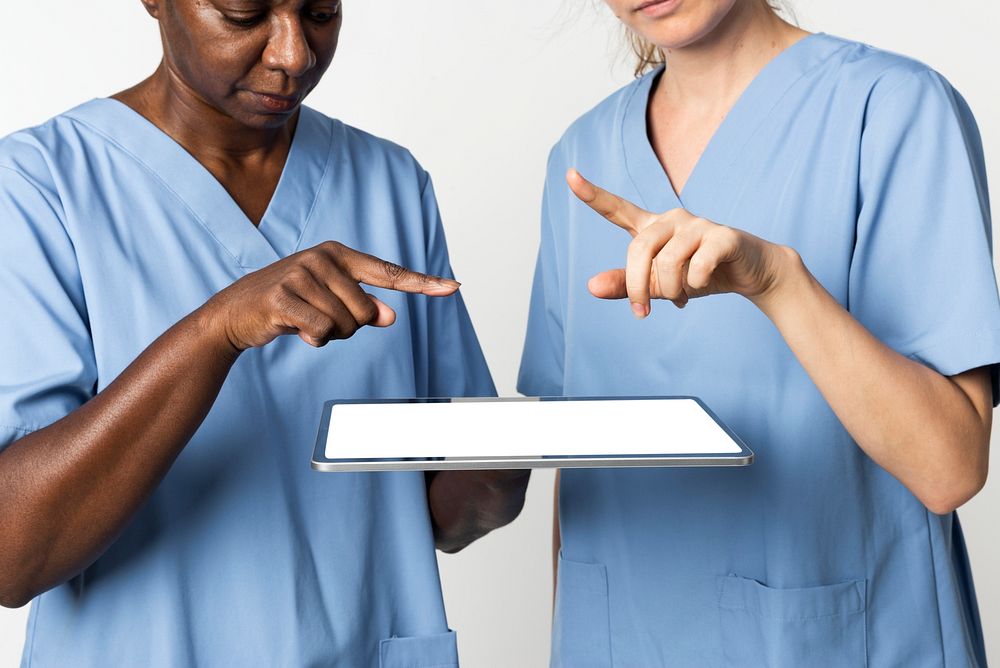 Doctors using tablet to diagnose medical technology
