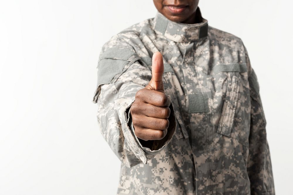 Female soldier with hand gesture