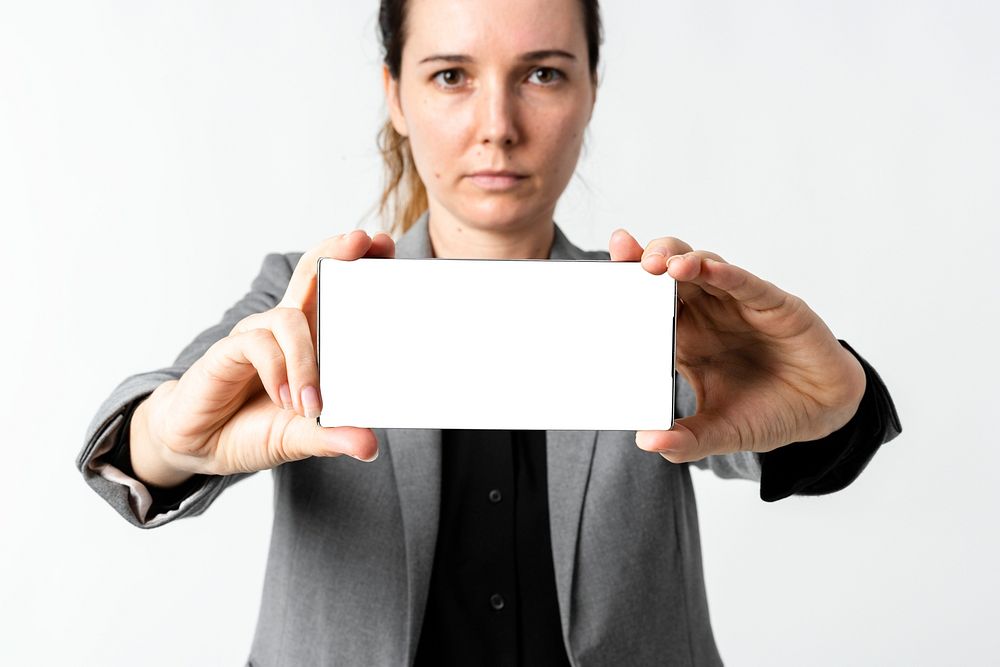 Phone screen mockup psd businesswoman showing it 