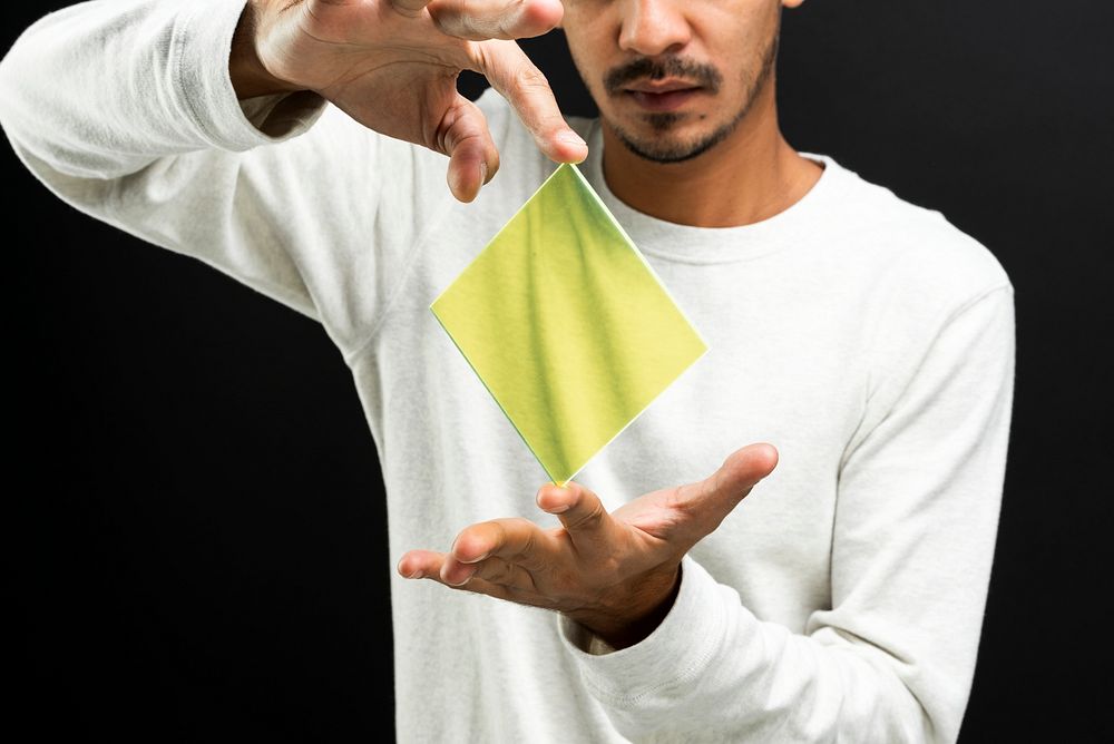 Man presenting yellow transparent plate advanced technology