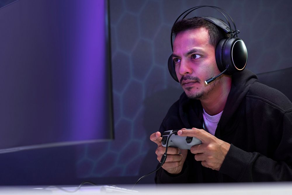 Professional eSport gamer playing a game with gaming controller