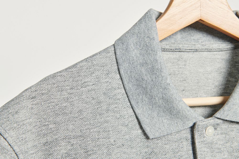 Men's gray collared shirt in a wooden hanger 