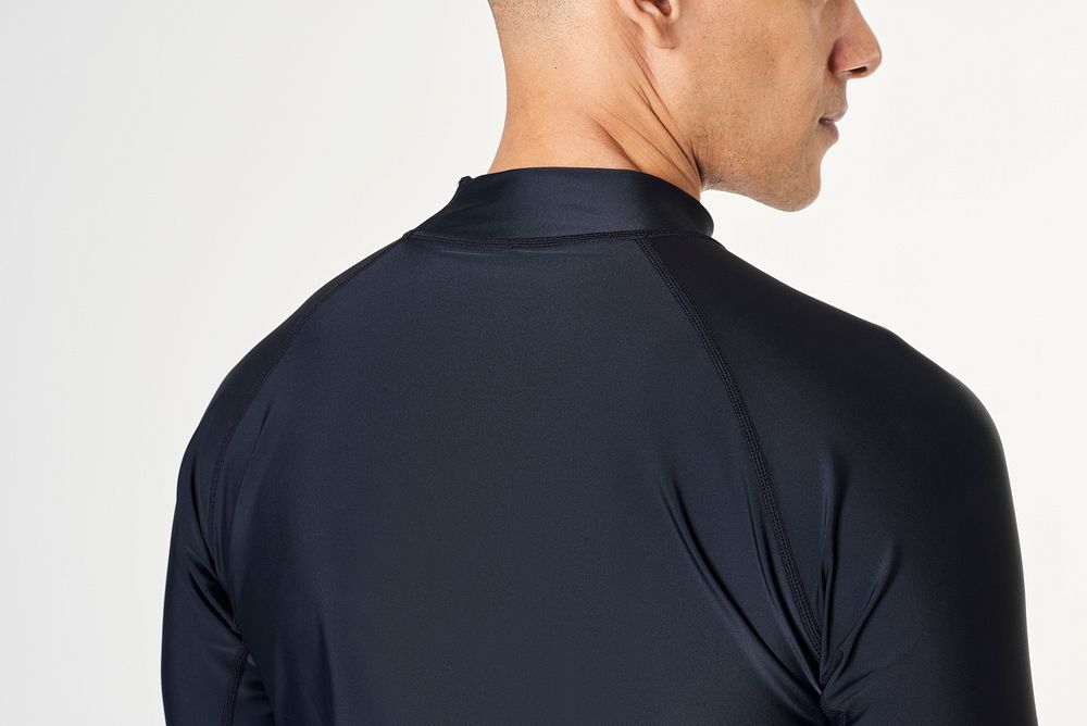 Rear view of a man in a long sleeved swimming top 