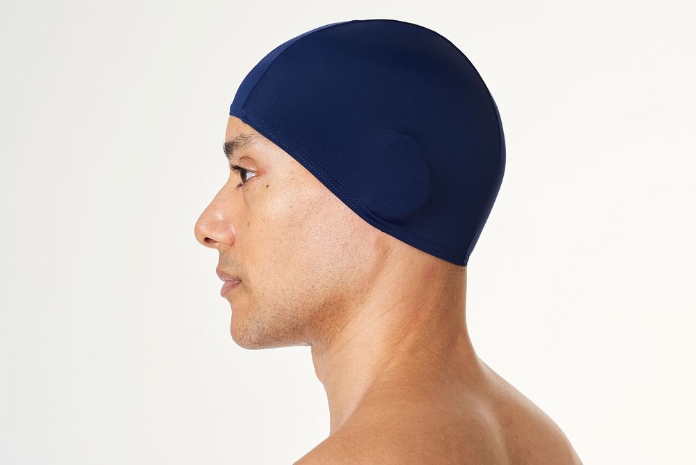Man wearing a navy blue swimming cap 