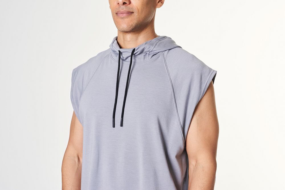 Man in a gray sleeveless hoodie 