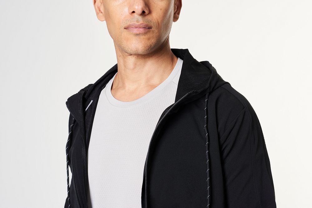 Man wearing a black hoodie over a  t-shirt 