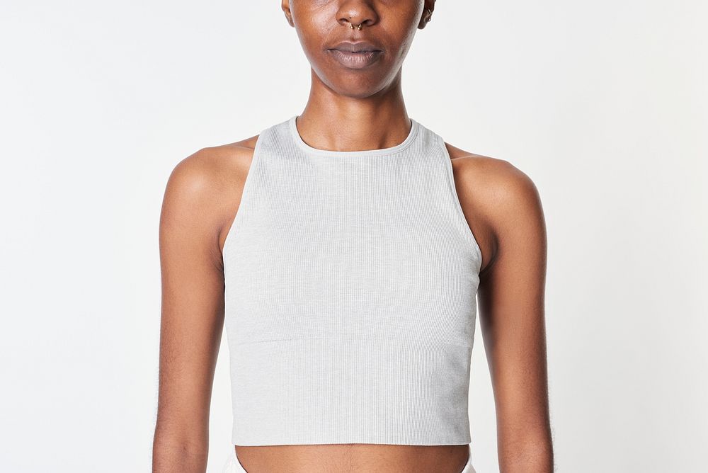 Black woman in a gray cropped top 