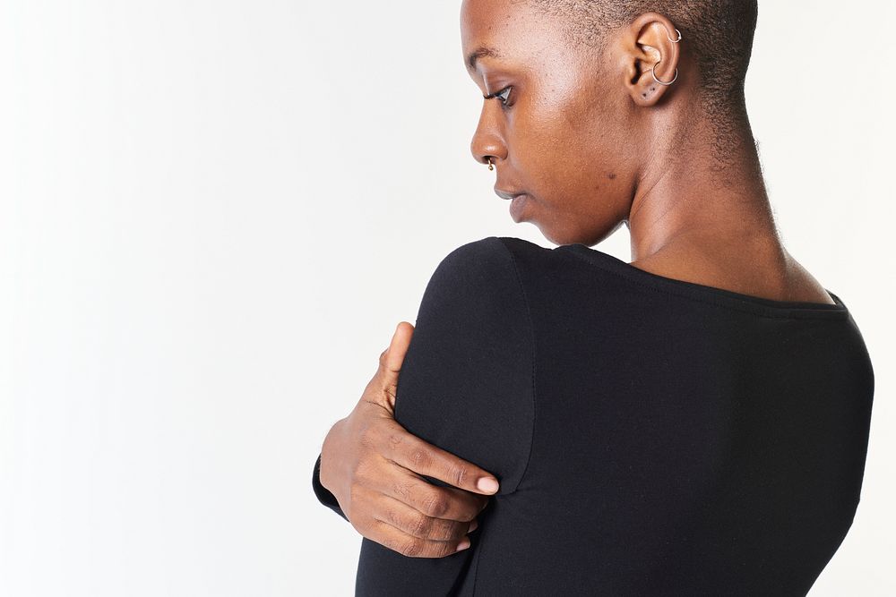 Black woman in long sleeved black t-shirt
