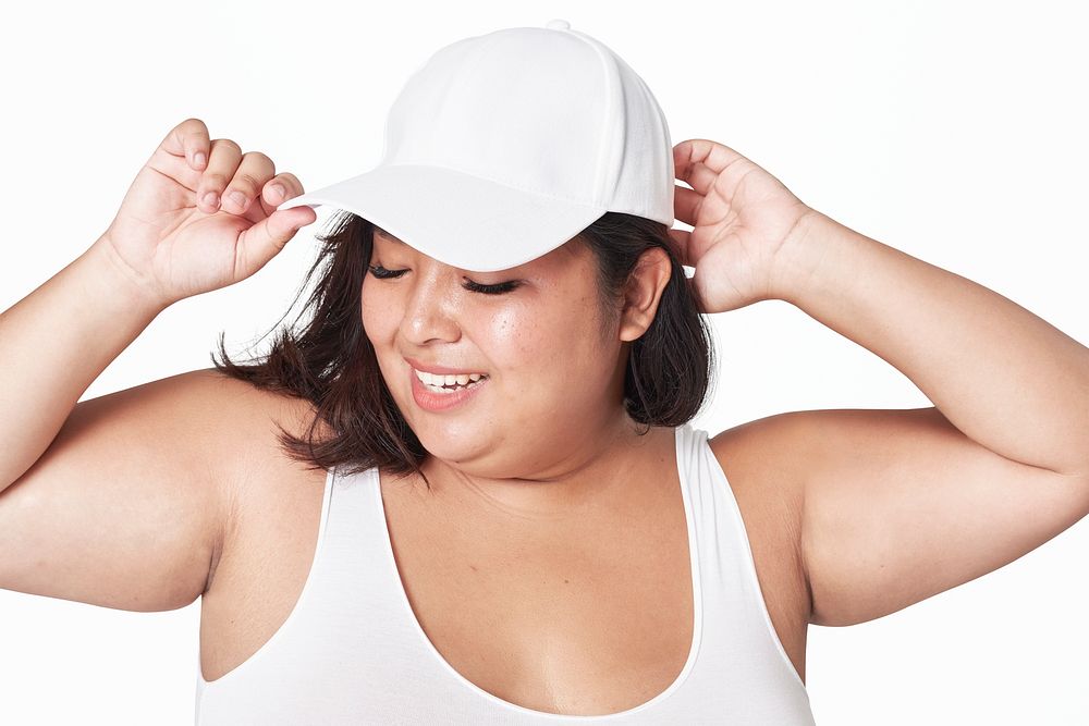 Attractive curvy woman psd white cap swimwear mockup apparel studio shoot