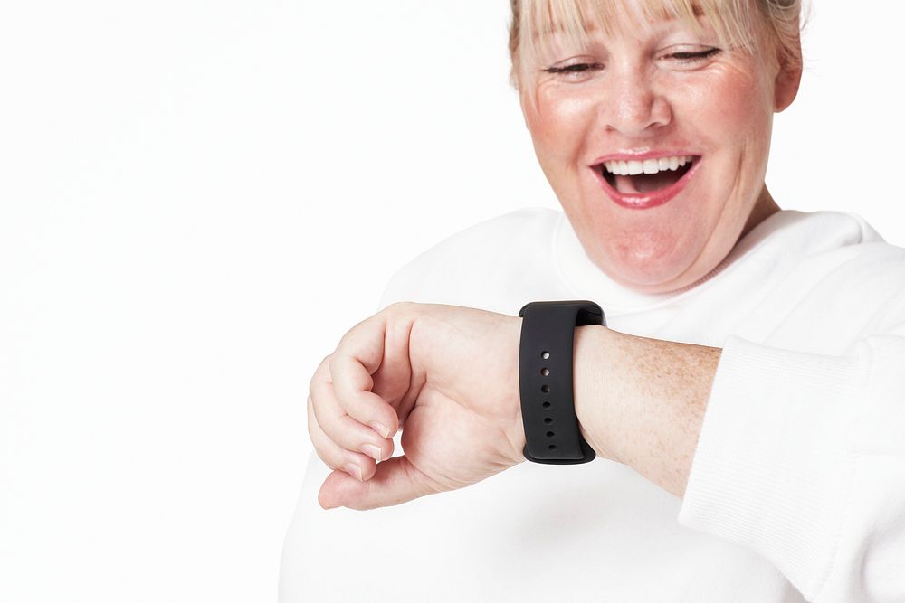 Psd woman checking time on smartwatch smiling mockup