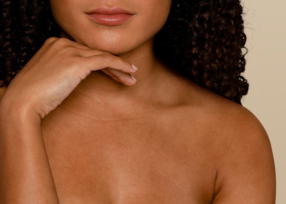 Woman with bare chest and tanned skin