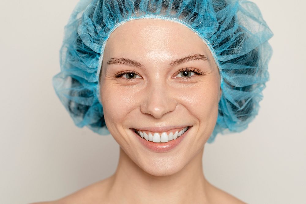 Woman in hairnet at beauty clinic 
