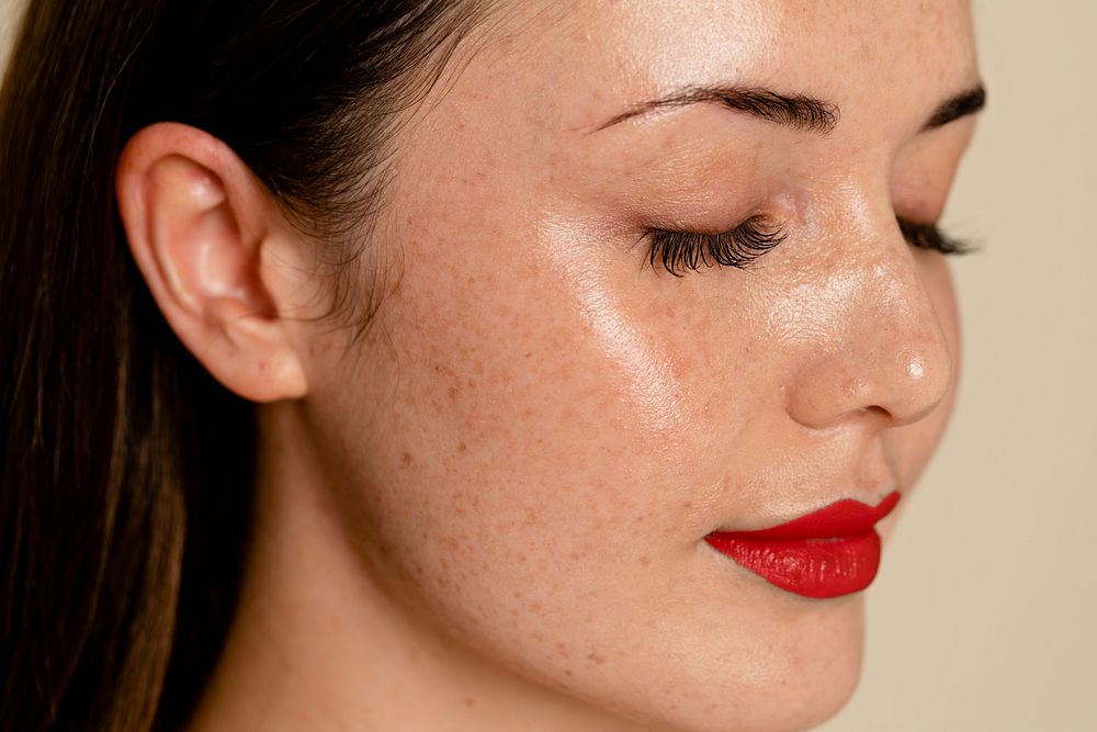 Glowing skin with freckles, close up