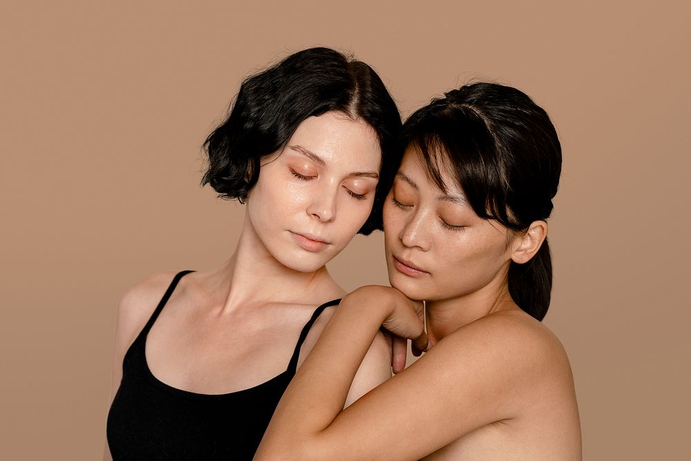 Diverse women with closed eyes, beige background