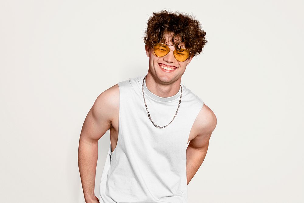 Cute young man with curly hair and glasses