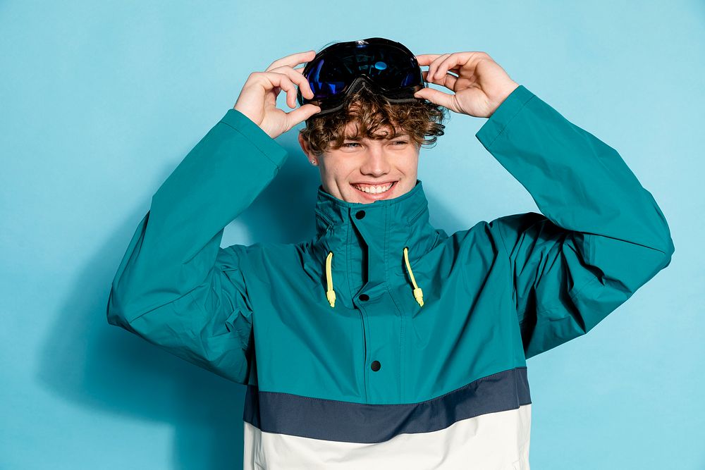 Skier wearing goggles and jacket 