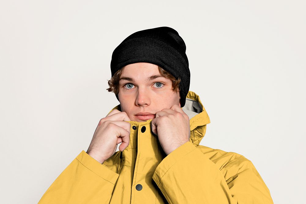 Young man in yellow winter jacket