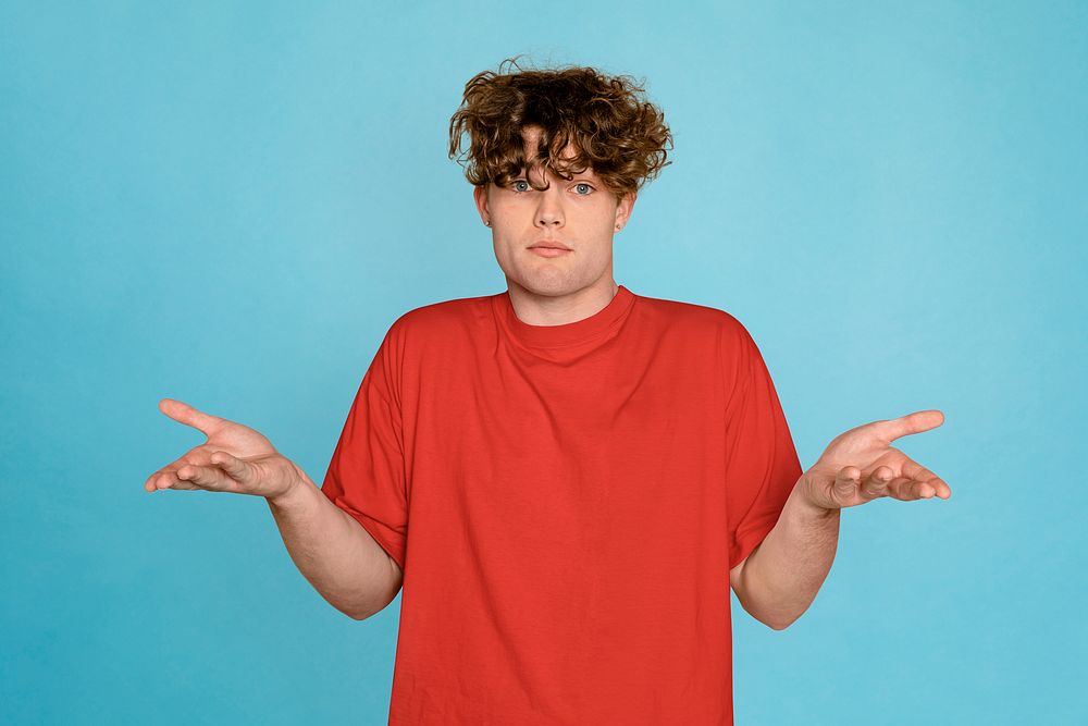 Confused man isolated on blue background