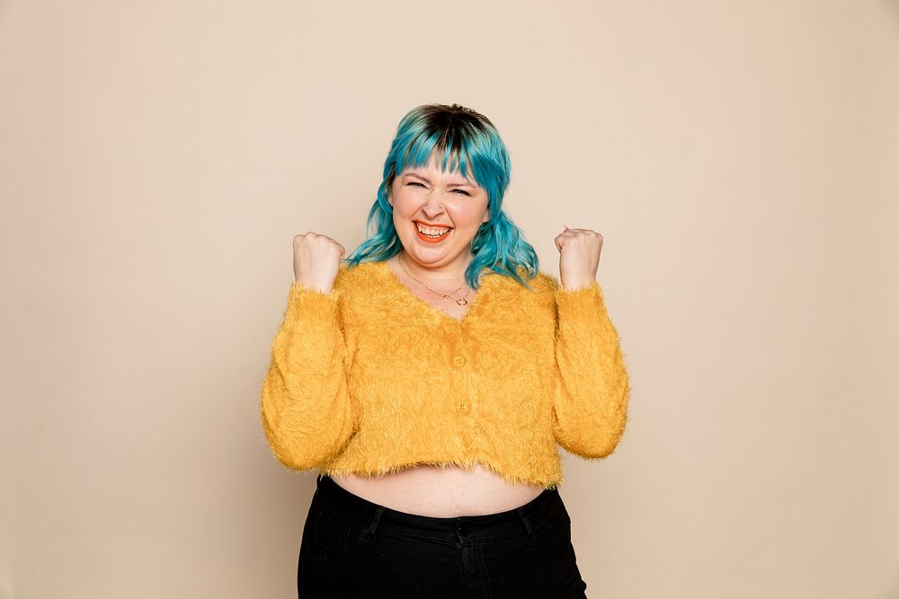 Blue hair woman celebrating her success 