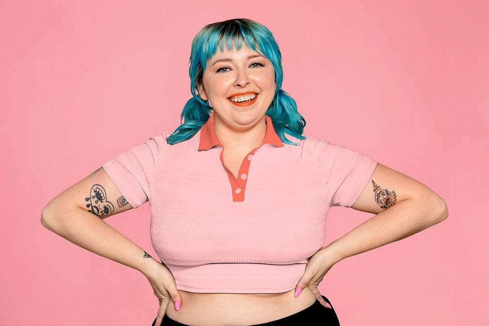 Confident & curvy woman on pink background