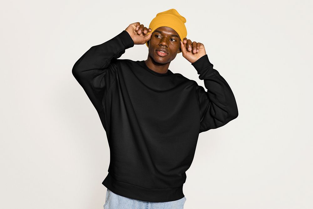 Black male model wearing yellow beanie 