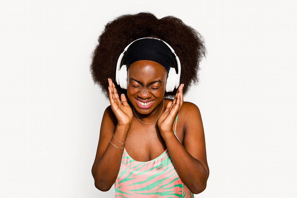 Woman listening to music, off white background