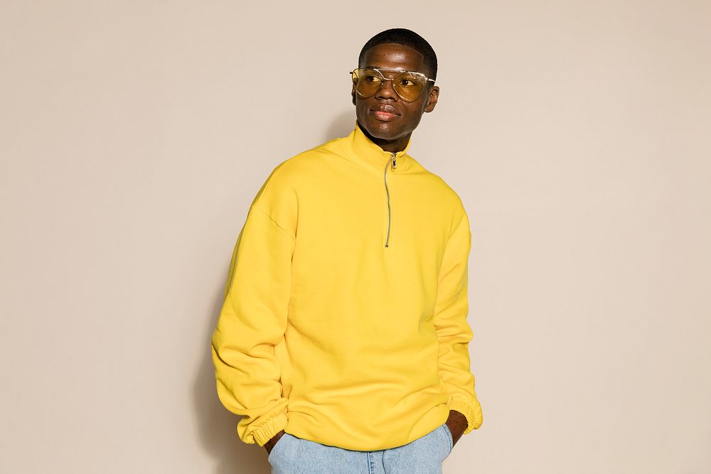 Black man in yellow zip up sweater 