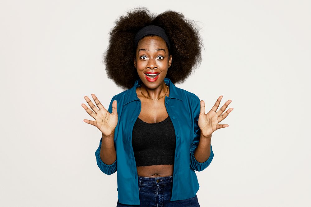 Surprised Africa American woman on off white background