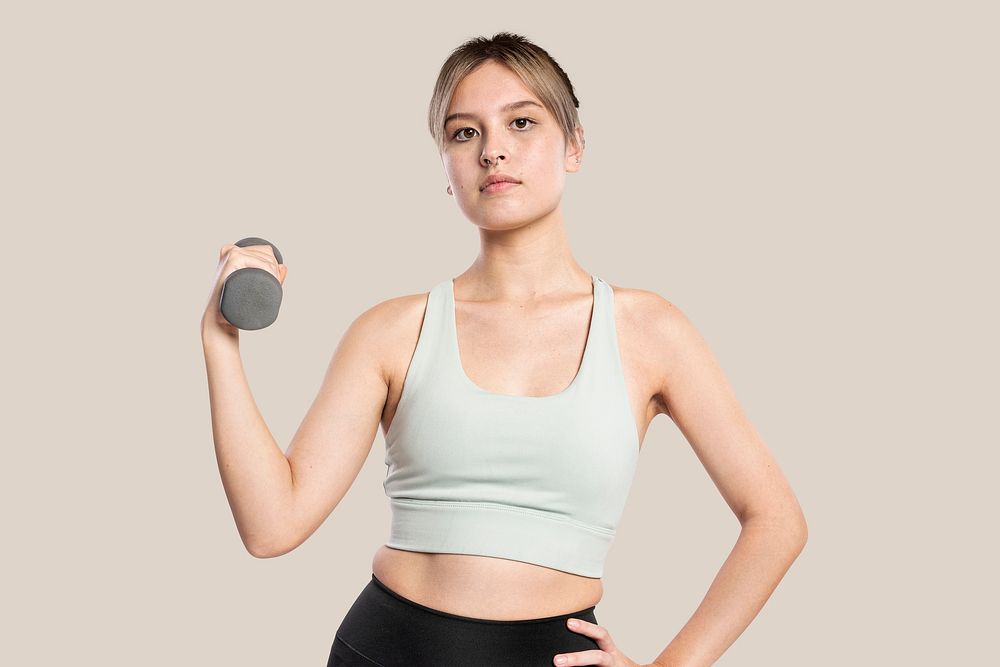 Active woman mockup psd holding a dumbbell