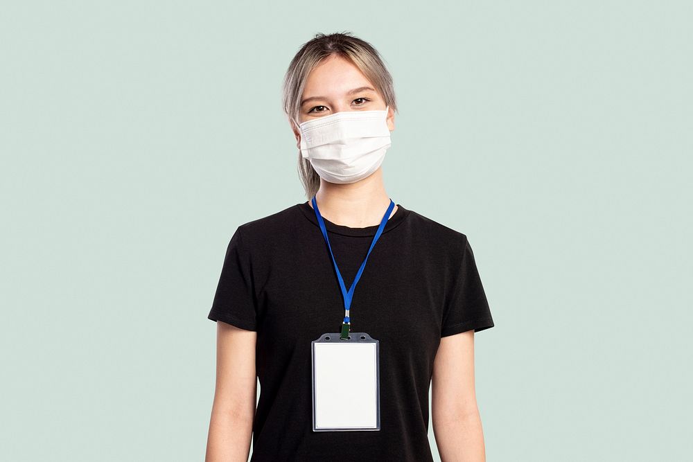 Woman wearing a face mask with a name tag