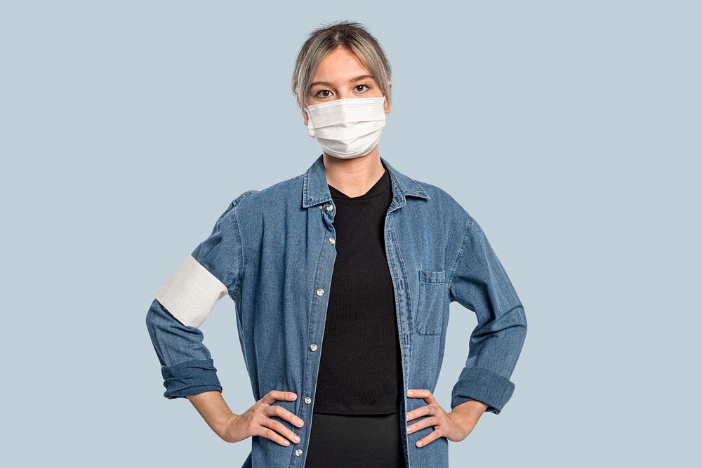 Female volunteer mockup psd wearing a face mask and armband
